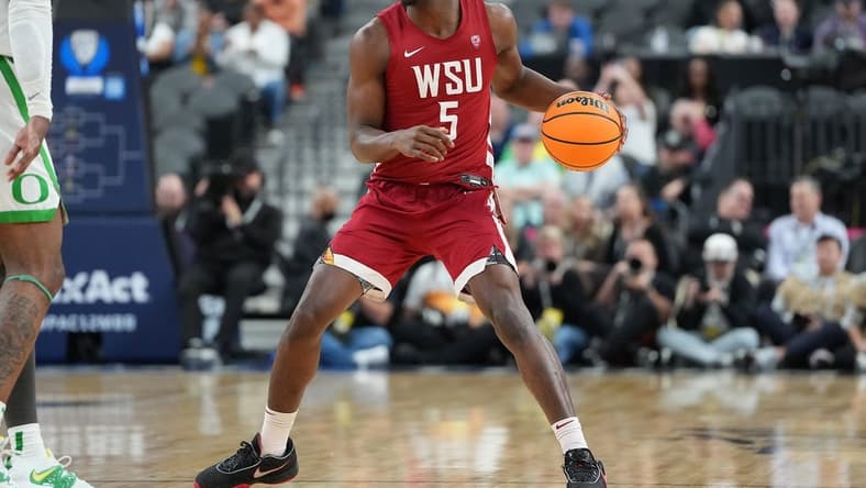 Mar 9, 2023; Las Vegas, NV, USA; Washington State Cougars guard TJ Bamba (5) dribbles against the Oregon Ducks during the second half at T-Mobile Arena. Mandatory Credit: Stephen R. Sylvanie-USA TODAY Sports