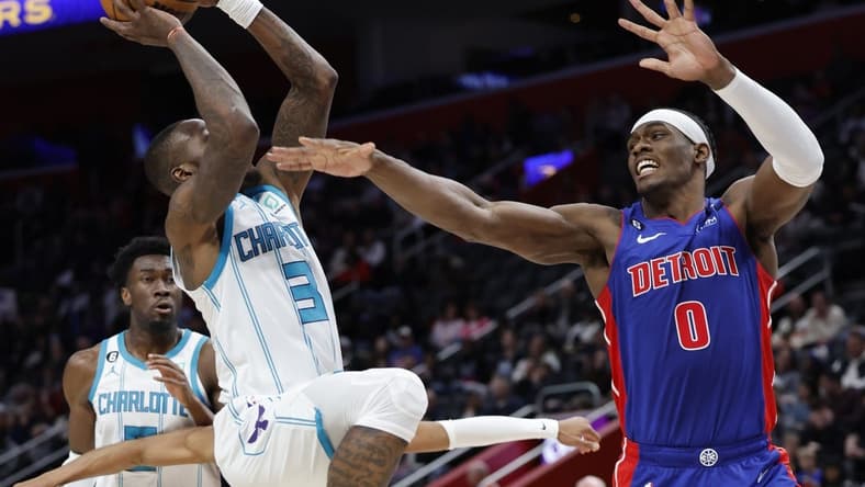 Mar 9, 2023; Detroit, Michigan, USA; Charlotte Hornets guard Terry Rozier (3) shoots on Detroit Pistons center Jalen Duren (0) in the first half at Little Caesars Arena. Mandatory Credit: Rick Osentoski-USA TODAY Sports