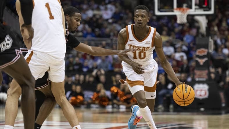 Mar 9, 2023; Kansas City, MO, USA; Texas Longhorns guard Sir'Jabari Rice (10) handles the ball against the Oklahoma State Cowboys in the second half at T-Mobile Center. Mandatory Credit: Amy Kontras-USA TODAY Sports