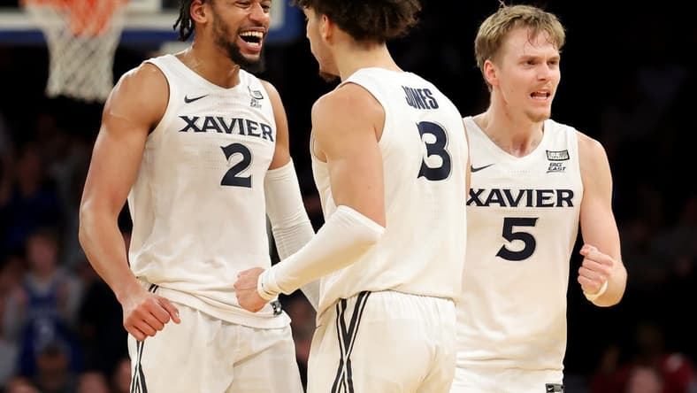 Mar 9, 2023; New York, NY, USA; Xavier Musketeers guard Colby Jones (3) celebrates with forward Jerome Hunter (2) and guard Adam Kunkel (5) during the second half against the DePaul Blue Demons at Madison Square Garden. Mandatory Credit: Brad Penner-USA TODAY Sports
