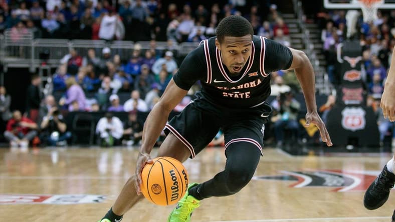 Mar 9, 2023; Kansas City, MO, USA; Oklahoma State Cowboys guard Bryce Thompson (1) drives to the basket during the second half against the Texas Longhorns at T-Mobile Center. Mandatory Credit: William Purnell-USA TODAY Sports