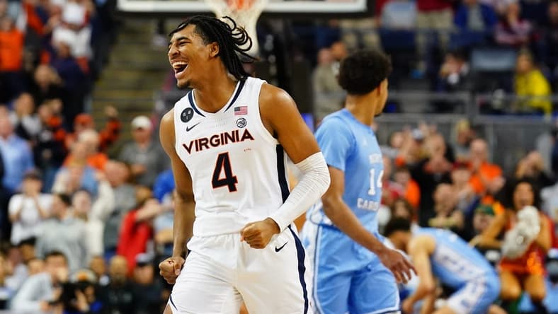 Mar 9, 2023; Greensboro, NC, USA; Virginia Cavaliers guard Armaan Franklin (4) reacts as he runs down the court against the North Carolina Tar Heels in the final seconds of the quarterfinals of the ACC tournament at Greensboro Coliseum. Mandatory Credit: John David Mercer-USA TODAY Sports