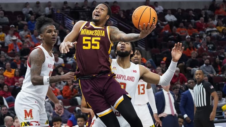 Mar 9, 2023; Chicago, IL, USA; Maryland Terrapins forward Julian Reese (10) defends Minnesota Golden Gophers guard Ta'lon Cooper (55) during the first half at United Center. Mandatory Credit: David Banks-USA TODAY Sports