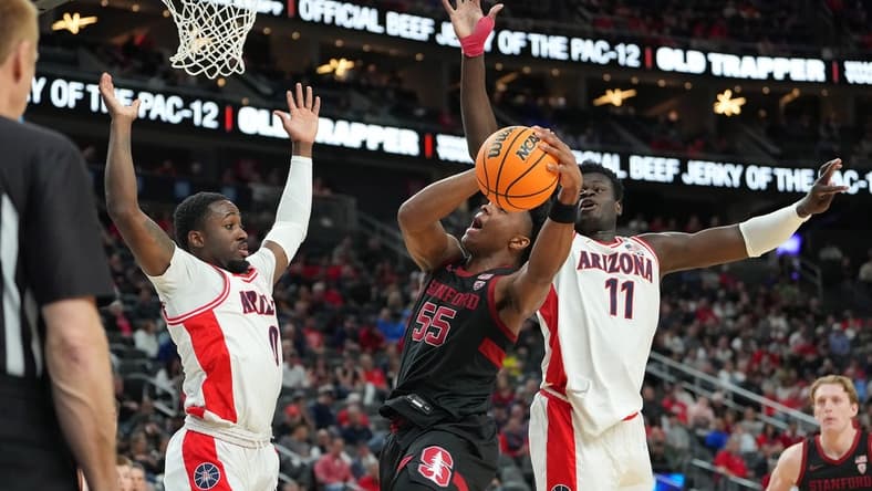 Mar 9, 2023; Las Vegas, NV, USA; Stanford Cardinal forward Harrison Ingram (55) attempts to shoot between Arizona Wildcats guard Courtney Ramey (0) and center Oumar Ballo (11) during the first half at T-Mobile Arena. Mandatory Credit: Stephen R. Sylvanie-USA TODAY Sports