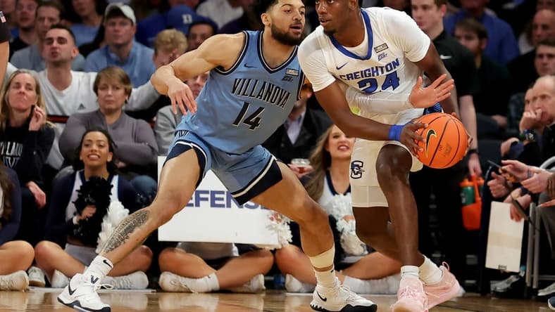 Mar 9, 2023; New York, NY, USA; Creighton Bluejays forward Arthur Kaluma (24) controls the ball against Villanova Wildcats guard Caleb Daniels (14) during the first half at Madison Square Garden. Mandatory Credit: Brad Penner-USA TODAY Sports