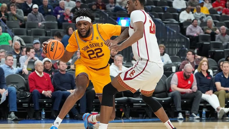 Mar 9, 2023; Las Vegas, NV, USA; Arizona State Sun Devils forward Warren Washington (22) dribbles against USC Trojans forward Joshua Morgan (24) during the first half at T-Mobile Arena. Mandatory Credit: Stephen R. Sylvanie-USA TODAY Sports