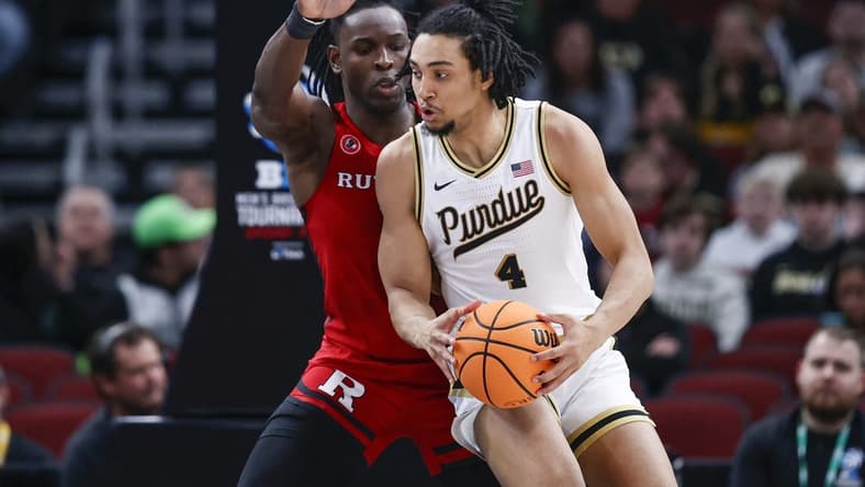 Mar 10, 2023; Chicago, IL, USA; Rutgers Scarlet Knights center Clifford Omoruyi (11) defends against Purdue Boilermakers forward Trey Kaufman-Renn (4) during the first half at United Center. Mandatory Credit: Kamil Krzaczynski-USA TODAY Sports