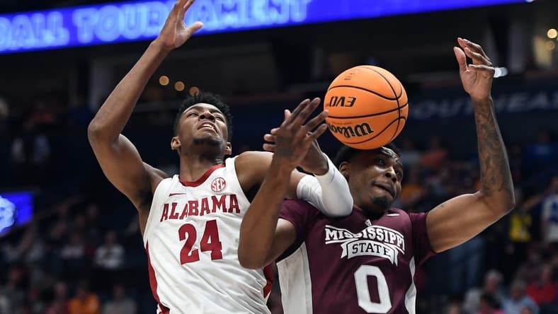 Mar 10, 2023; Nashville, TN, USA; Alabama Crimson Tide forward Brandon Miller (24) battles with Mississippi State Bulldogs forward D.J. Jeffries (0) for a rebound during the first half at Bridgestone Arena. Mandatory Credit: Christopher Hanewinckel-USA TODAY Sports