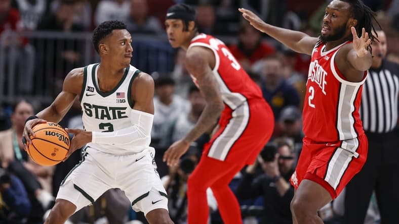 Mar 10, 2023; Chicago, IL, USA; Michigan State Spartans guard Tyson Walker (2) looks to pass the ball against Ohio State Buckeyes guard Bruce Thornton (2) during the first half at United Center. Mandatory Credit: Kamil Krzaczynski-USA TODAY Sports