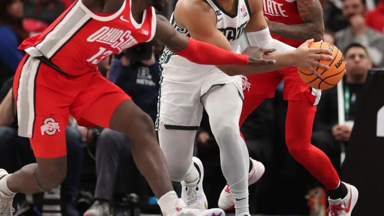 Michigan State Spartans guard Pierre Brooks (1) rebounds against Ohio State Buckeyes guard Isaac Likekele (13) during first-half action in the Big Ten tournament quarterfinals at United Center in Chicago on Friday, March 10, 2023.

Msubig 031023 Kd1665