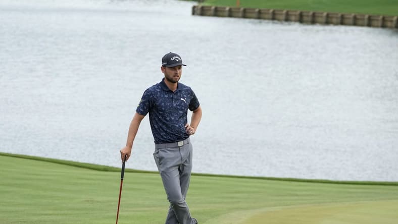 Mar 10, 2023; Ponte Vedra Beach, Florida, USA; Adam Svensson waits on the 18th green during the second round of THE PLAYERS Championship golf tournament. Mandatory Credit: David Yeazell-USA TODAY Sports