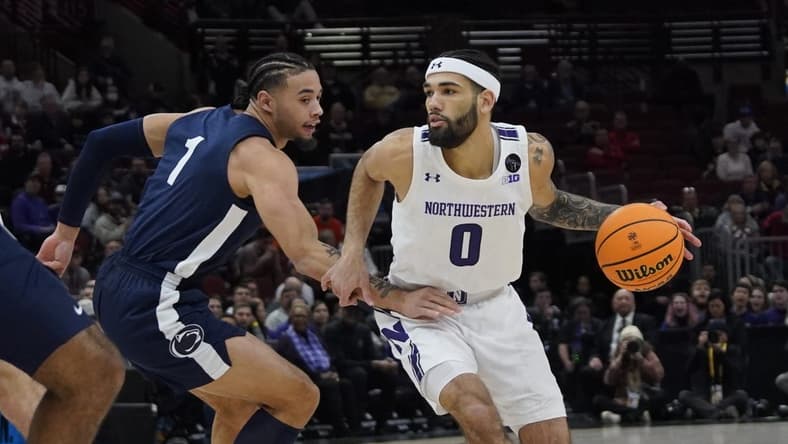 Mar 10, 2023; Chicago, IL, USA; Northwestern Wildcats guard Boo Buie (0) is defended by Penn State Nittany Lions guard Seth Lundy (1) during the first half at United Center. Mandatory Credit: David Banks-USA TODAY Sports