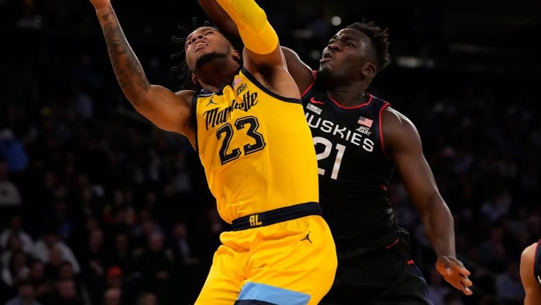 Mar 10, 2023; New York, NY, USA; Marquette Golden Eagles forward David Joplin (23) shoots against Connecticut Huskies forward Adama Sanogo (21) in the first half at Madison Square Garden. Mandatory Credit: Robert Deutsch-USA TODAY Sports