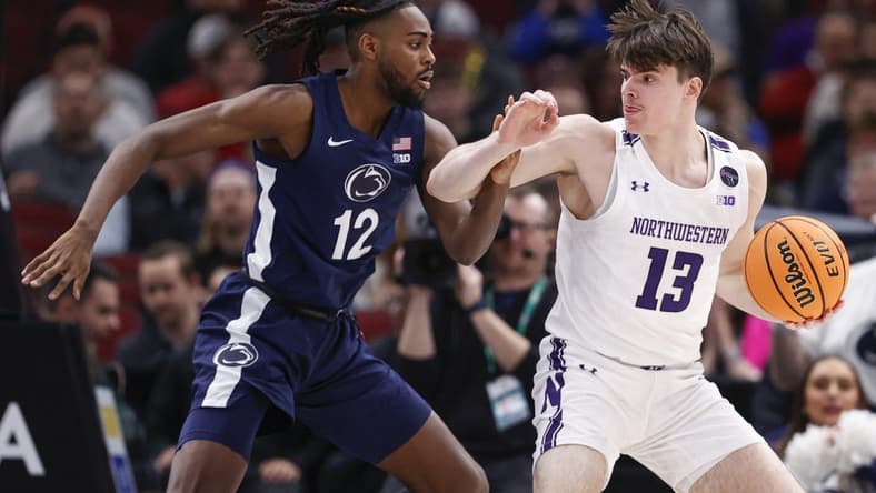 Mar 10, 2023; Chicago, IL, USA; Penn State Nittany Lions guard Evan Mahaffey (12) defends against Northwestern Wildcats guard Brooks Barnhizer (13) during the first half at United Center. Mandatory Credit: Kamil Krzaczynski-USA TODAY Sports