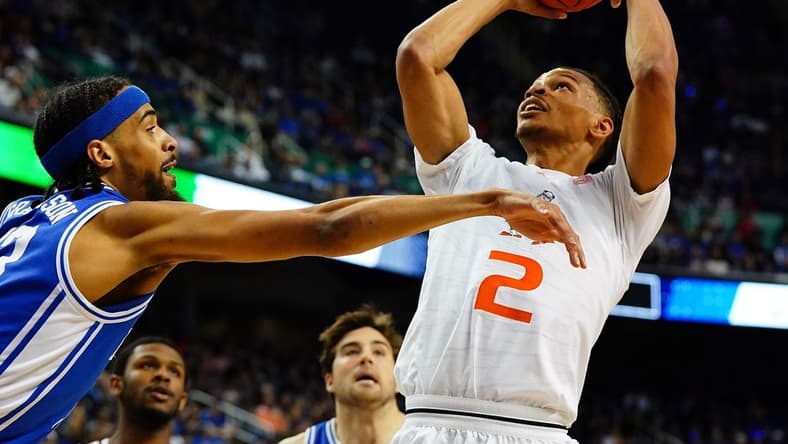 Mar 10, 2023; Greensboro, NC, USA; Miami (Fl) Hurricanes guard Isaiah Wong (2) goes to the basket against Duke Blue Devils guard Jacob Grandison (13) during the first half of the semifinals of the ACC tournament at Greensboro Coliseum. Mandatory Credit: John David Mercer-USA TODAY Sports