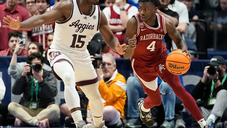 Arkansas guard Davonte Davis (4) dribbles past Texas A&M forward Henry Coleman III (15) during the second half of a quarterfinal SEC Men   s Basketball Tournament game at Bridgestone Arena Friday, March 10, 2023, in Nashville, Tenn.

Sec Basketball Arkansas Vs Texas A M