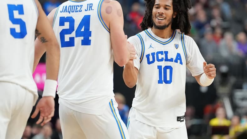Mar 10, 2023; Las Vegas, NV, USA; UCLA Bruins guard Tyger Campbell (10) celebrates with UCLA Bruins guard Jaime Jaquez Jr. (24) after a scoring play against the Oregon Ducks during the second half at T-Mobile Arena. Mandatory Credit: Stephen R. Sylvanie-USA TODAY Sports