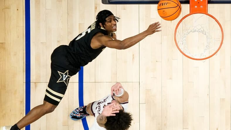 Vanderbilt guard Ezra Manjon (5) shoots over Texas A&M forward Andersson Garcia (11) during the second half of a SEC Men   s Basketball Tournament semifinal game at Bridgestone Arena in Nashville, Tenn., Saturday, March 11, 2023.

Vandy Tam Sec 031123 An 009