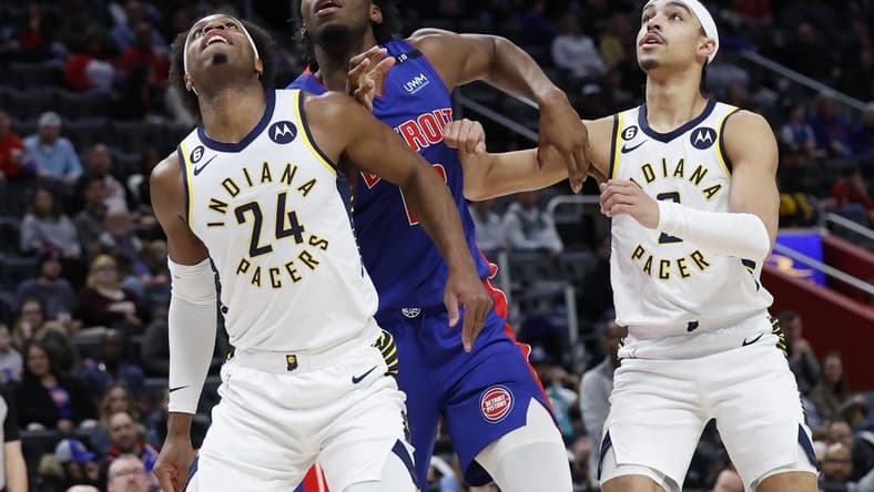 Mar 11, 2023; Detroit, Michigan, USA;  Indiana Pacers guard Buddy Hield (24) Detroit Pistons center James Wiseman (13) and Pacers guard Andrew Nembhard (2) look for a rebound in the first half at Little Caesars Arena. Mandatory Credit: Rick Osentoski-USA TODAY Sports