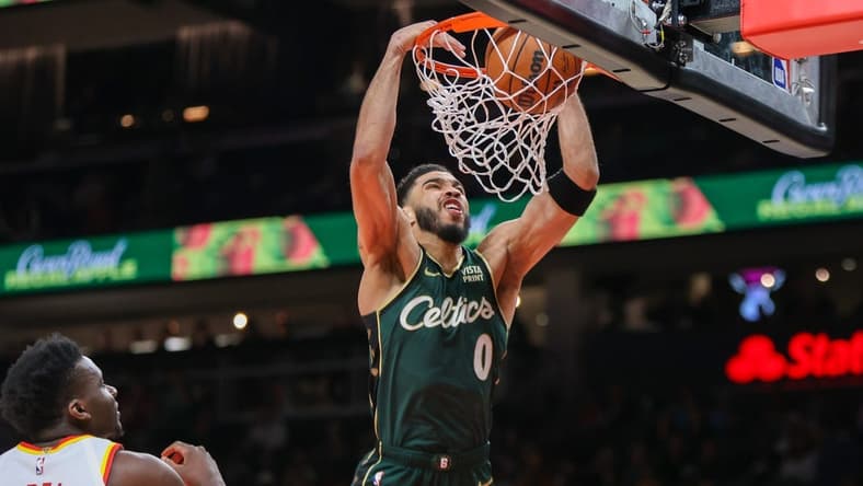 Mar 11, 2023; Atlanta, Georgia, USA; Boston Celtics forward Jayson Tatum (0) dunks against the Atlanta Hawks in the first quarter at State Farm Arena. Mandatory Credit: Brett Davis-USA TODAY Sports