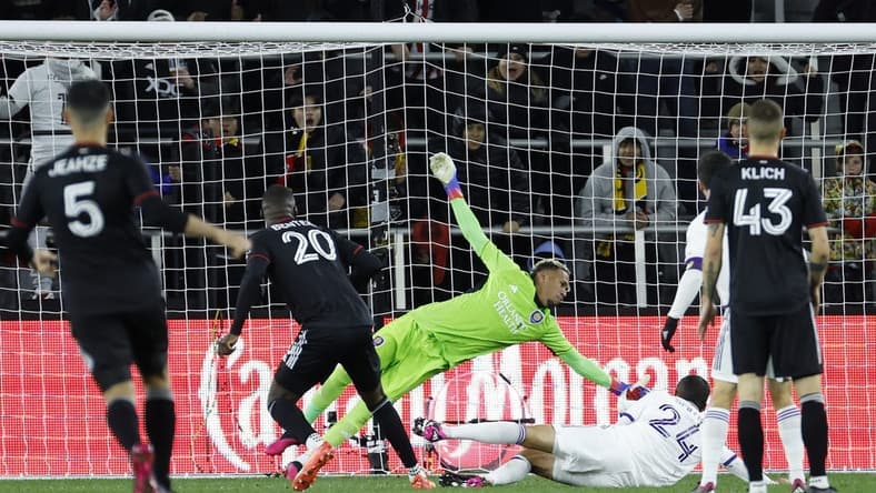 Mar 11, 2023; Washington, District of Columbia, USA; Orlando City SC goalkeeper Pedro Gallese (1) makes a save on D.C. United forward Christian Benteke (20) in the first half at Audi Field. Mandatory Credit: Geoff Burke-USA TODAY Sports