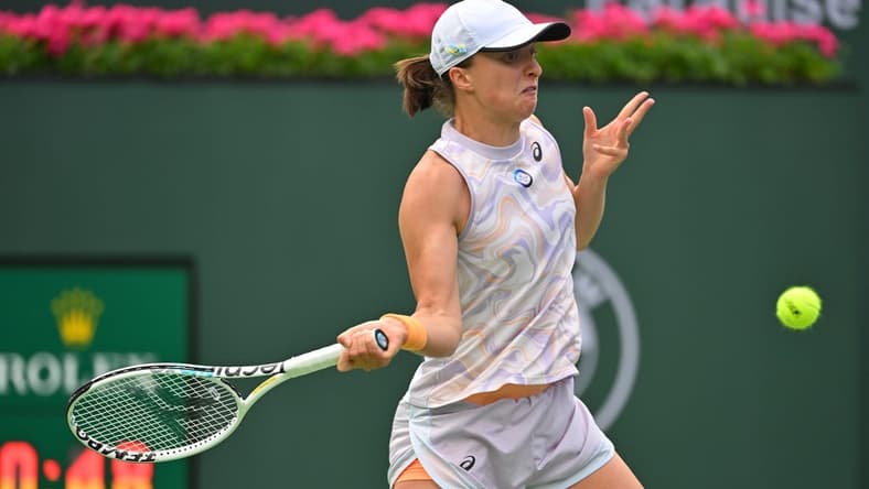 Mar 11, 2023; Indian Wells, CA, USA;  Iga Swiatek (POL) hits a shot as she won her second round match against Claire Liu (USA) in the BNP Paribas Open at the Indian Wells Tennis Garden. Mandatory Credit: Jayne Kamin-Oncea-USA TODAY Sports