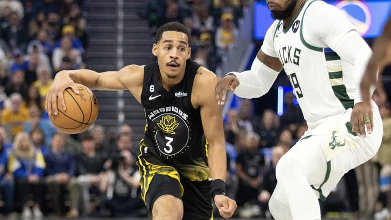 Mar 11, 2023; San Francisco, California, USA; Golden State Warriors guard Jordan Poole (3) dribbles the ball around Milwaukee Bucks forward Jae Crowder (99) during the first quarter at Chase Center. Mandatory Credit: D. Ross Cameron-USA TODAY Sports