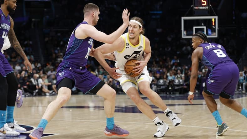 Mar 11, 2023; Charlotte, North Carolina, USA; Utah Jazz forward Kelly Olynyk (41) tries to drive past Charlotte Hornets guard Svi Mykhailiuk (10) during the second half at Spectrum Center. Mandatory Credit: Brian Westerholt-USA TODAY Sports
