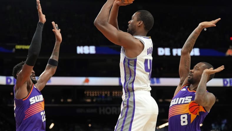 Mar 11, 2023; Phoenix, Arizona, USA; Sacramento Kings forward Harrison Barnes (40) shoots over Phoenix Suns center Deandre Ayton (22) and Phoenix Suns guard Terrence Ross (8) during the first half at Footprint Center. Mandatory Credit: Joe Camporeale-USA TODAY Sports