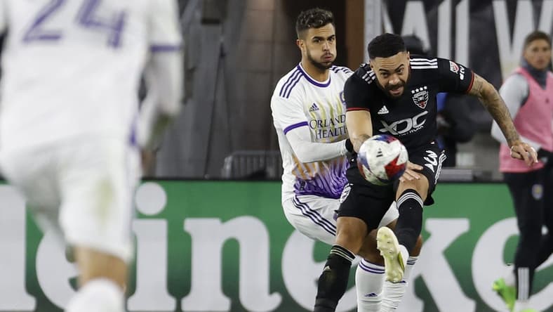 Mar 11, 2023; Washington, District of Columbia, USA; D.C. United defender Derrick Williams (3) clears the ball from Orlando City SC midfielder Mart n Ojeda (11) in the second half at Audi Field. Mandatory Credit: Geoff Burke-USA TODAY Sports