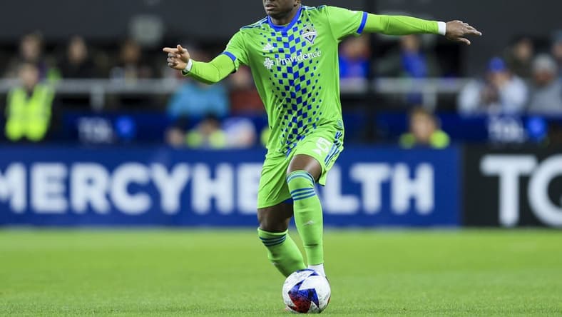 Mar 11, 2023; Cincinnati, Ohio, USA; Seattle Sounders FC defender Nouhou (5) dribbles the ball against FC Cincinnati in the second half at TQL Stadium. Mandatory Credit: Aaron Doster-USA TODAY Sports