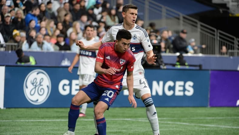Mar 11, 2023; Vancouver, British Columbia, CAN; FC Dallas forward Alan Velasco (20) in action against Vancouver Whitecaps defender Ranko Veselinovic (4) at BC Place. Mandatory Credit: Anne-Marie Sorvin-USA TODAY Sports