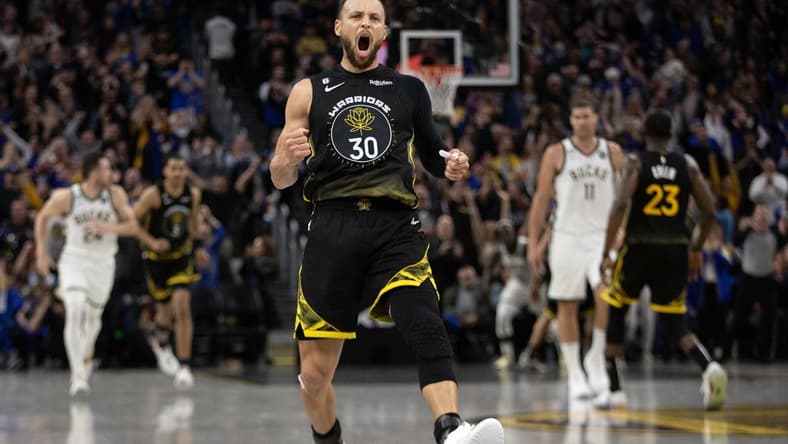 Mar 11, 2023; San Francisco, California, USA; Golden State Warriors guard Stephen Curry (30) reacts after making a three point basket to tie the score against the Milwaukee Bucks during the fourth quarter at Chase Center. Mandatory Credit: D. Ross Cameron-USA TODAY Sports