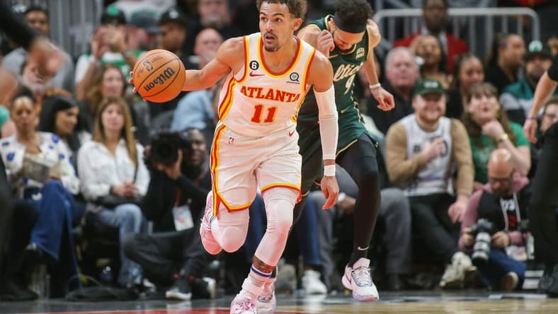 Mar 11, 2023; Atlanta, Georgia, USA; Atlanta Hawks guard Trae Young (11) dribbles against the Boston Celtics in the second half at State Farm Arena. Mandatory Credit: Brett Davis-USA TODAY Sports