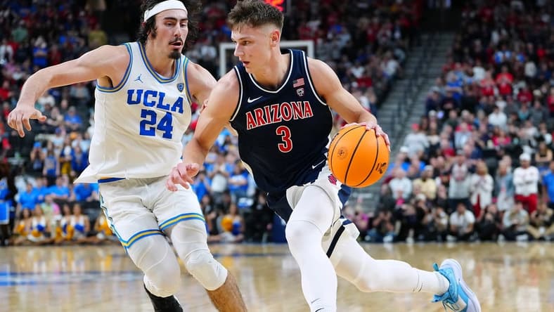 Mar 11, 2023; Las Vegas, NV, USA; Arizona Wildcats guard Pelle Larsson (3) dribbles against UCLA Bruins guard Jaime Jaquez Jr. (24) during the second half at T-Mobile Arena. Mandatory Credit: Stephen R. Sylvanie-USA TODAY Sports