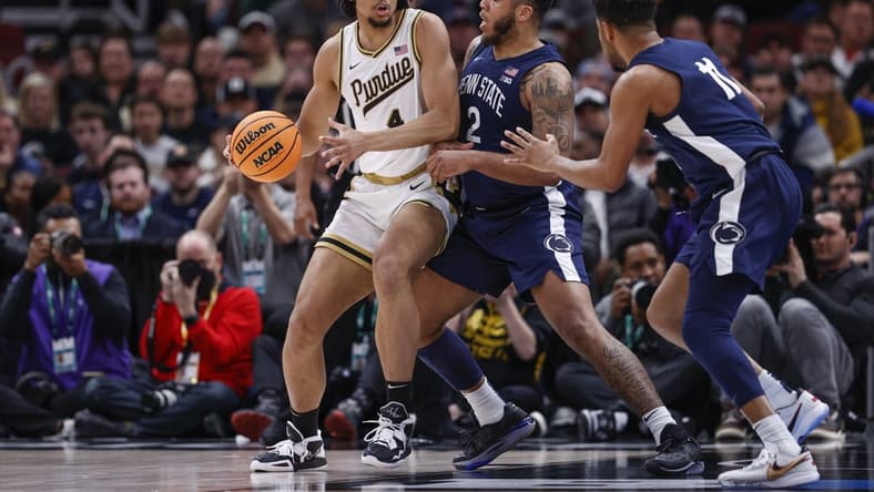 Mar 12, 2023; Chicago, IL, USA; Penn State Nittany Lions guard Myles Dread (2) defends against Purdue Boilermakers forward Trey Kaufman-Renn (4) during the first half at United Center. Mandatory Credit: Kamil Krzaczynski-USA TODAY Sports