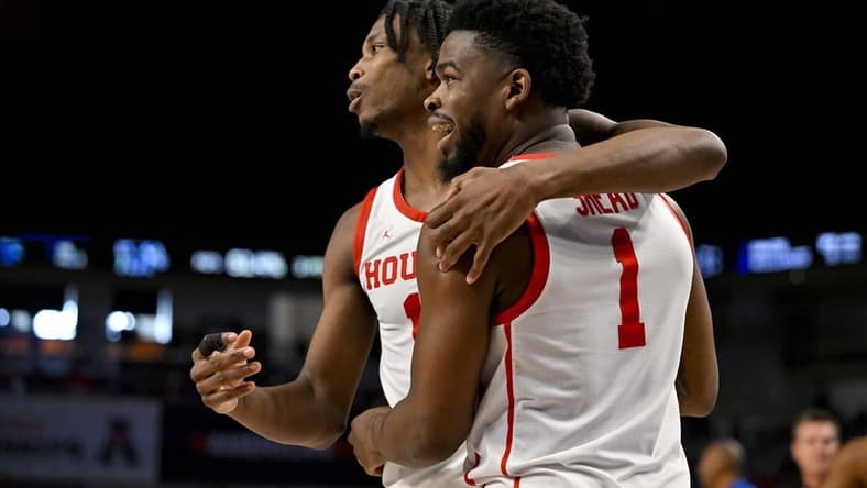Mar 12, 2023; Fort Worth, TX, USA; Houston Cougars guard Tramon Mark (12) hugs guard Jamal Shead (1) during the second half against the Memphis Tigers at Dickies Arena. Mandatory Credit: Jerome Miron-USA TODAY Sports