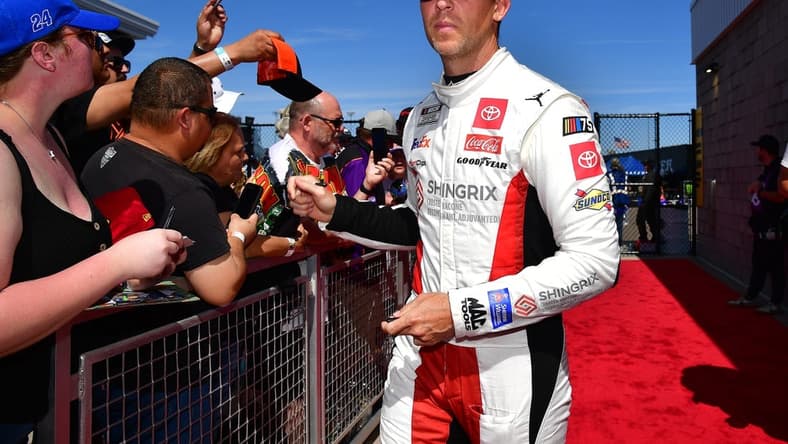 Mar 12, 2023; Avondale, Arizona, USA; NASCAR Cup Series driver Denny Hamlin (11) before the United Rentals Work United 500 at Phoenix Raceway. Mandatory Credit: Gary A. Vasquez-USA TODAY Sports