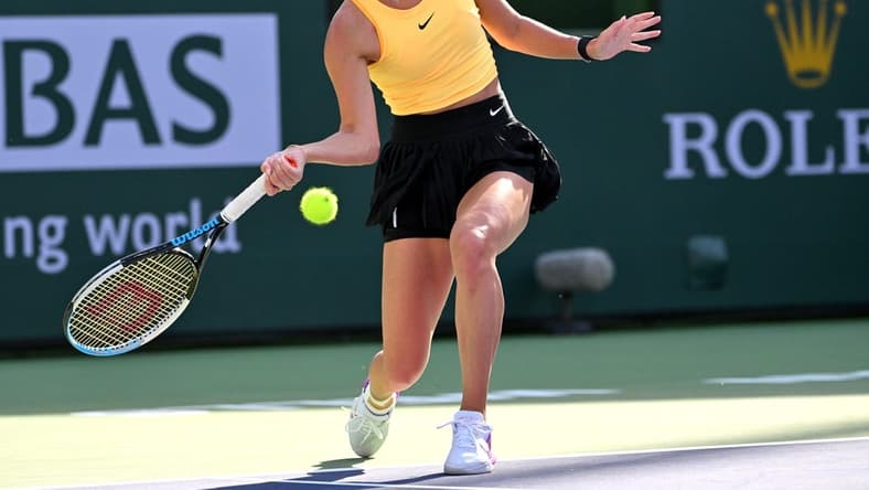 Mar 12, 2023; Indian Wells, CA, USA;    Anastasia Potapova (RUS) hits a shot in her fourth round match against Jessica Pegula (USA) in the BNP Paribas Open at the Indian Wells Tennis Garden. Mandatory Credit: Jayne Kamin-Oncea-USA TODAY Sports