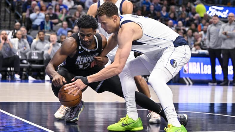 Mar 13, 2023; Dallas, Texas, USA; Memphis Grizzlies forward Jaren Jackson Jr. (13) and Dallas Mavericks center Dwight Powell (7) battle for control of the loose ball during the second quarter at the American Airlines Center. Mandatory Credit: Jerome Miron-USA TODAY Sports