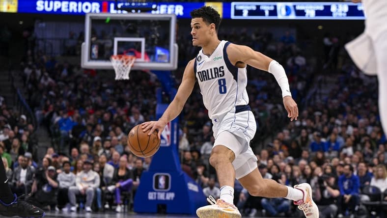 Mar 13, 2023; Dallas, Texas, USA; Dallas Mavericks guard Josh Green (8) brings the ball up court against the Memphis Grizzlies during the second half at the American Airlines Center. Mandatory Credit: Jerome Miron-USA TODAY Sports
