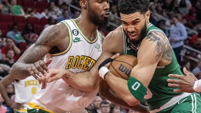 Mar 13, 2023; Houston, Texas, USA; Boston Celtics forward Jayson Tatum (0) moves to the net against Houston Rockets forward Tari Eason (17) in the third quarter at Toyota Center. Mandatory Credit: Thomas Shea-USA TODAY Sports