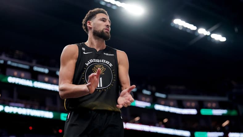 Mar 13, 2023; San Francisco, California, USA; Golden State Warriors guard Klay Thompson (11) claps his hands after knocking the ball out of bounds on defense against the Phoenix Suns in the third quarter at the Chase Center. Mandatory Credit: Cary Edmondson-USA TODAY Sports