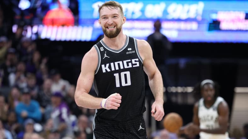 Mar 13, 2023; Sacramento, California, USA; Sacramento Kings power forward Domantas Sabonis (10) smiles after a play against the Milwaukee Bucks during the third quarter at Golden 1 Center. Mandatory Credit: Kelley L Cox-USA TODAY Sports