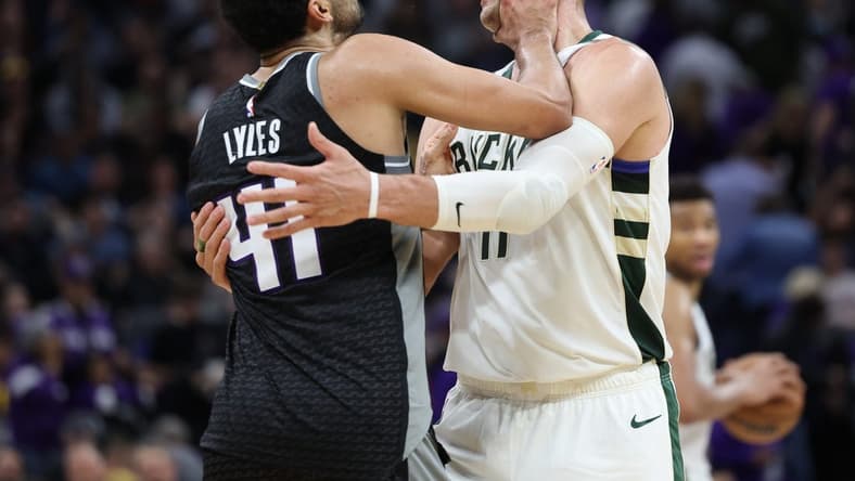Mar 13, 2023; Sacramento, California, USA; Sacramento Kings center Trey Lyles (41) confronts Milwaukee Bucks center Brook Lopez (11) during the fourth quarter at Golden 1 Center. Mandatory Credit: Kelley L Cox-USA TODAY Sports