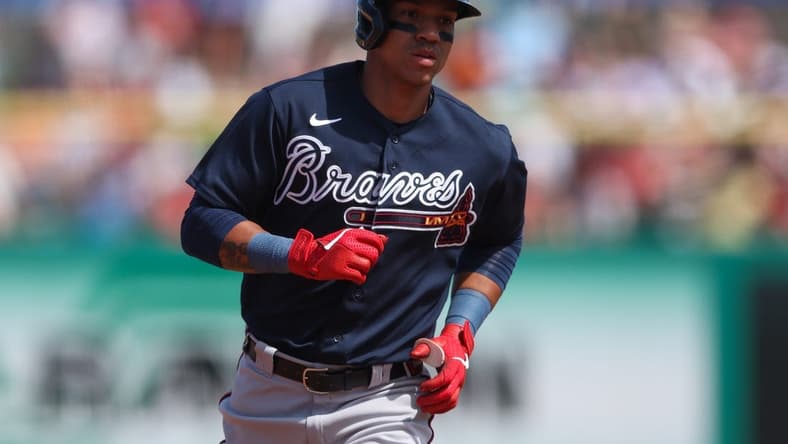 Mar 14, 2023; Clearwater, Florida, USA; Atlanta Braves third baseman Ehire Adrianza (9) rounds the bases after hitting a grand slam home run against the Philadelphia Phillies in the fifth inning during spring training at BayCare Ballpark. Mandatory Credit: Nathan Ray Seebeck-USA TODAY Sports