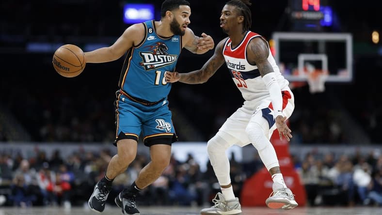 Mar 14, 2023; Washington, District of Columbia, USA; Detroit Pistons guard Cory Joseph (18) dribbles the ball as Washington Wizards guard Delon Wright (55) defends in the second quarter at Capital One Arena. Mandatory Credit: Geoff Burke-USA TODAY Sports