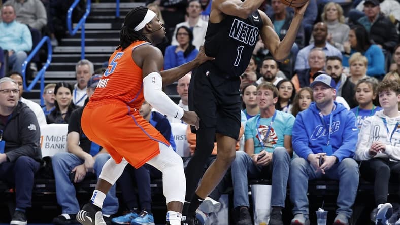 Mar 14, 2023; Oklahoma City, Oklahoma, USA; Brooklyn Nets forward Mikal Bridges (1) is defended by Oklahoma City Thunder guard Luguentz Dort (5) during the second quarter at Paycom Center. Mandatory Credit: Alonzo Adams-USA TODAY Sports