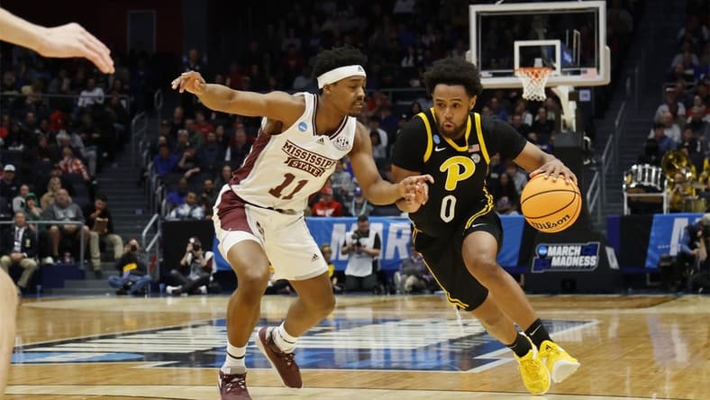 Mar 14, 2023; Dayton, OH, USA; Pittsburgh Panthers guard Nelly Cummings (0) moves the ball defended by Mississippi State Bulldogs guard Eric Reed Jr. (11) in the first half at UD Arena. Mandatory Credit: Rick Osentoski-USA TODAY Sports