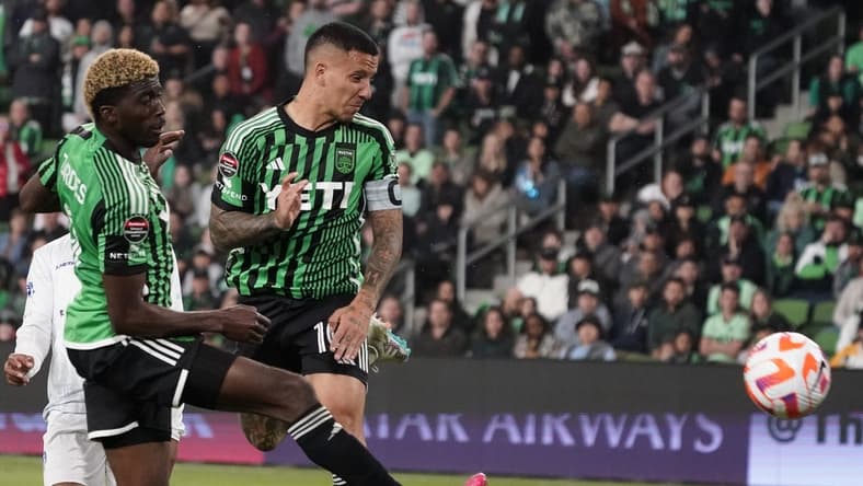 Mar 14, 2023; Austin, TX, USA; Austin FC forward Sebastian Driussi (10) shoots a goal off of his arm in front of forward Gyasi Zardes (9) during the second half against Violette AC at Q2 Stadium. Mandatory Credit: Scott Wachter-USA TODAY Sports